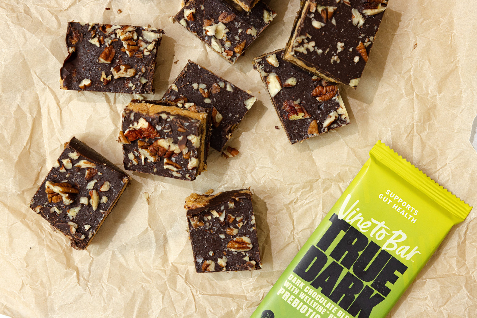 overhead view protein candy bark squares with vine to bar true dark chocolate bar