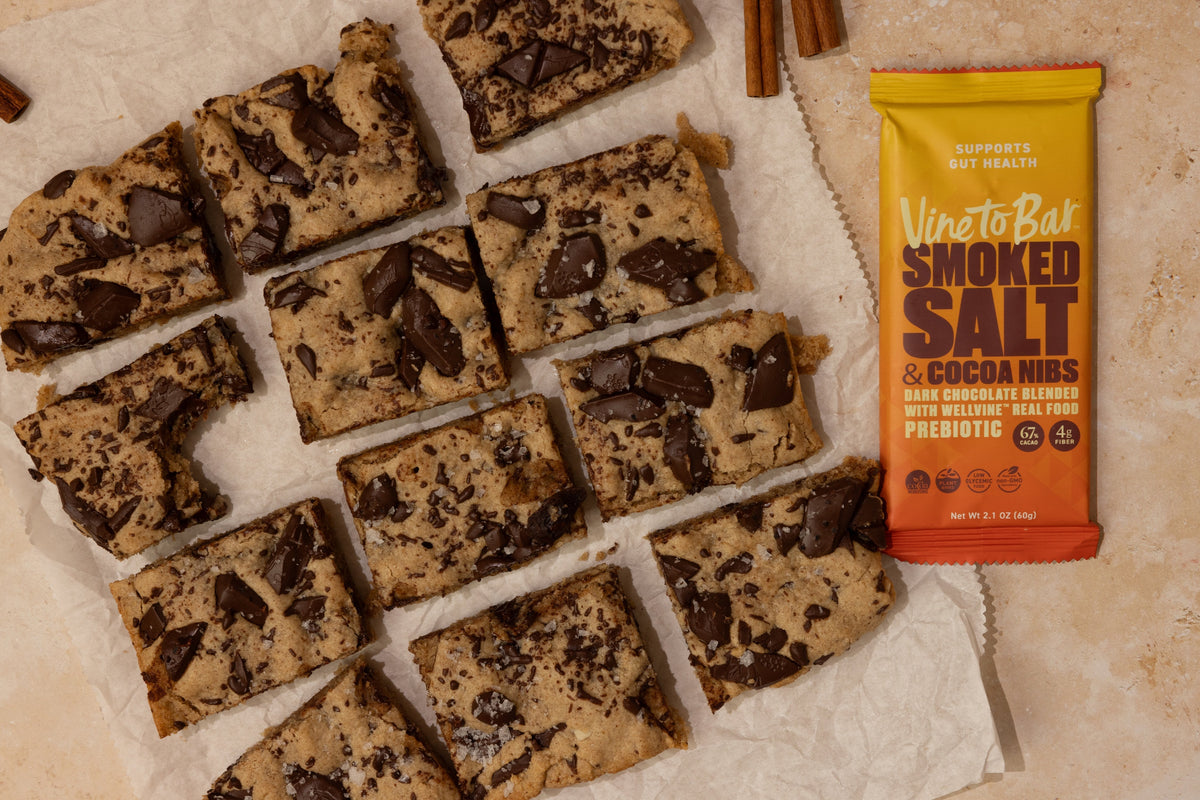 overhead view pumpkin spice chocolate chunk blondies next to vine to bar smoked salt and cocoa nibs