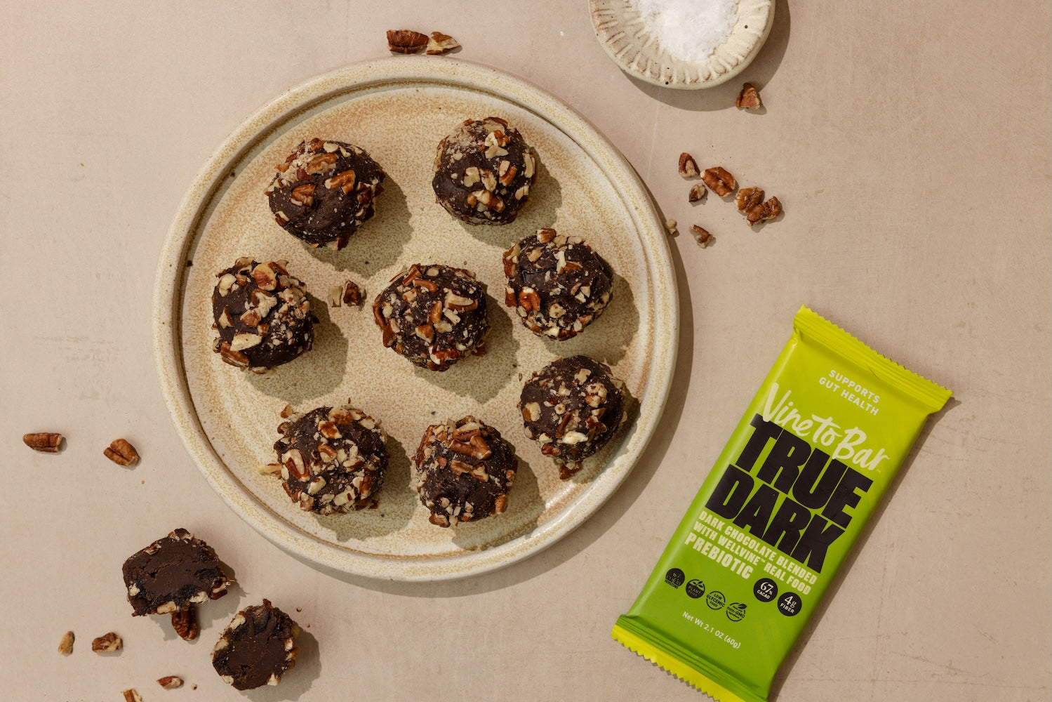 plate-of-pecan-bliss-balls-with-vine-to-bar-dark-chocolate