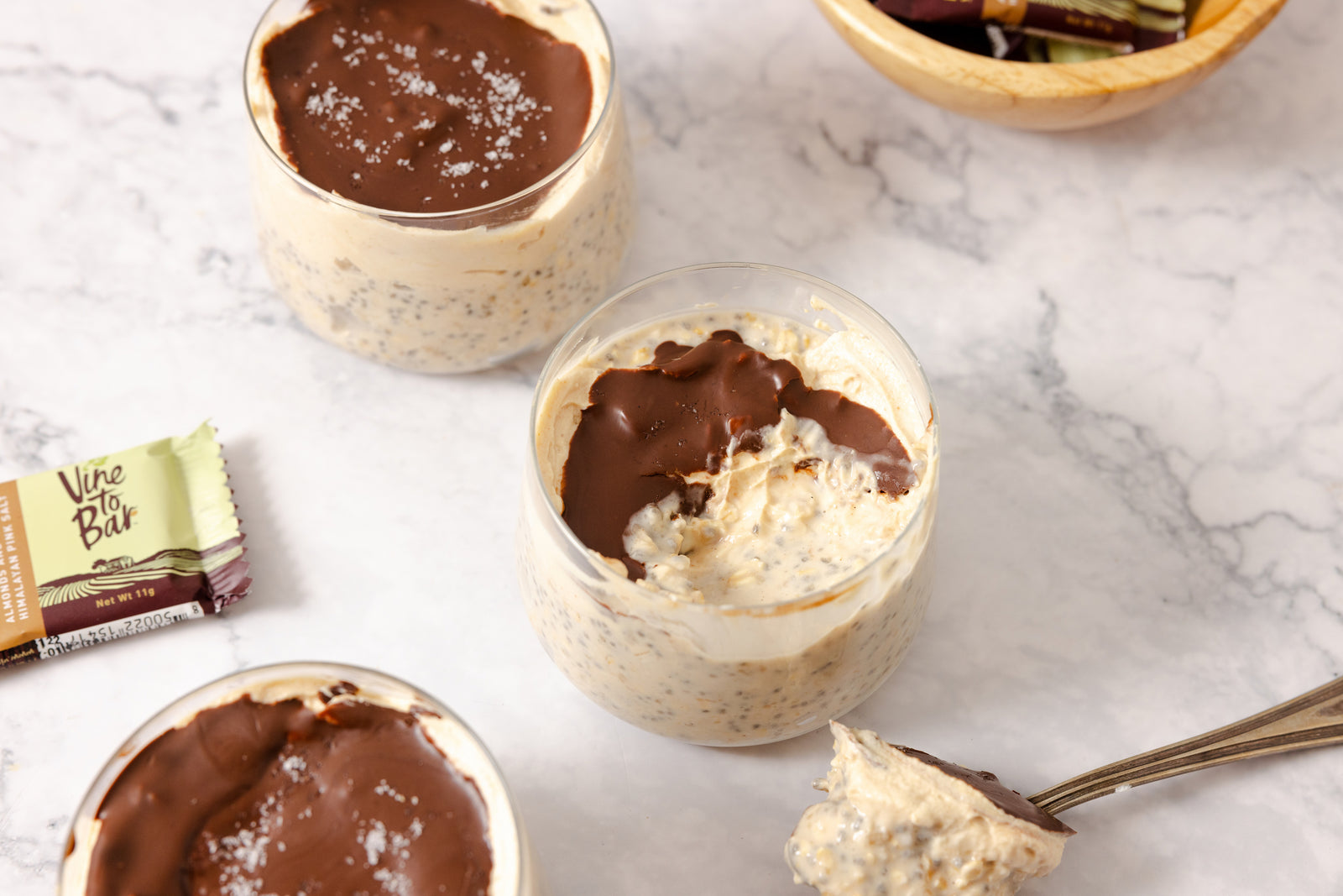 two-cups-of-overnight-oats-topped-with-chocolate-and-salt