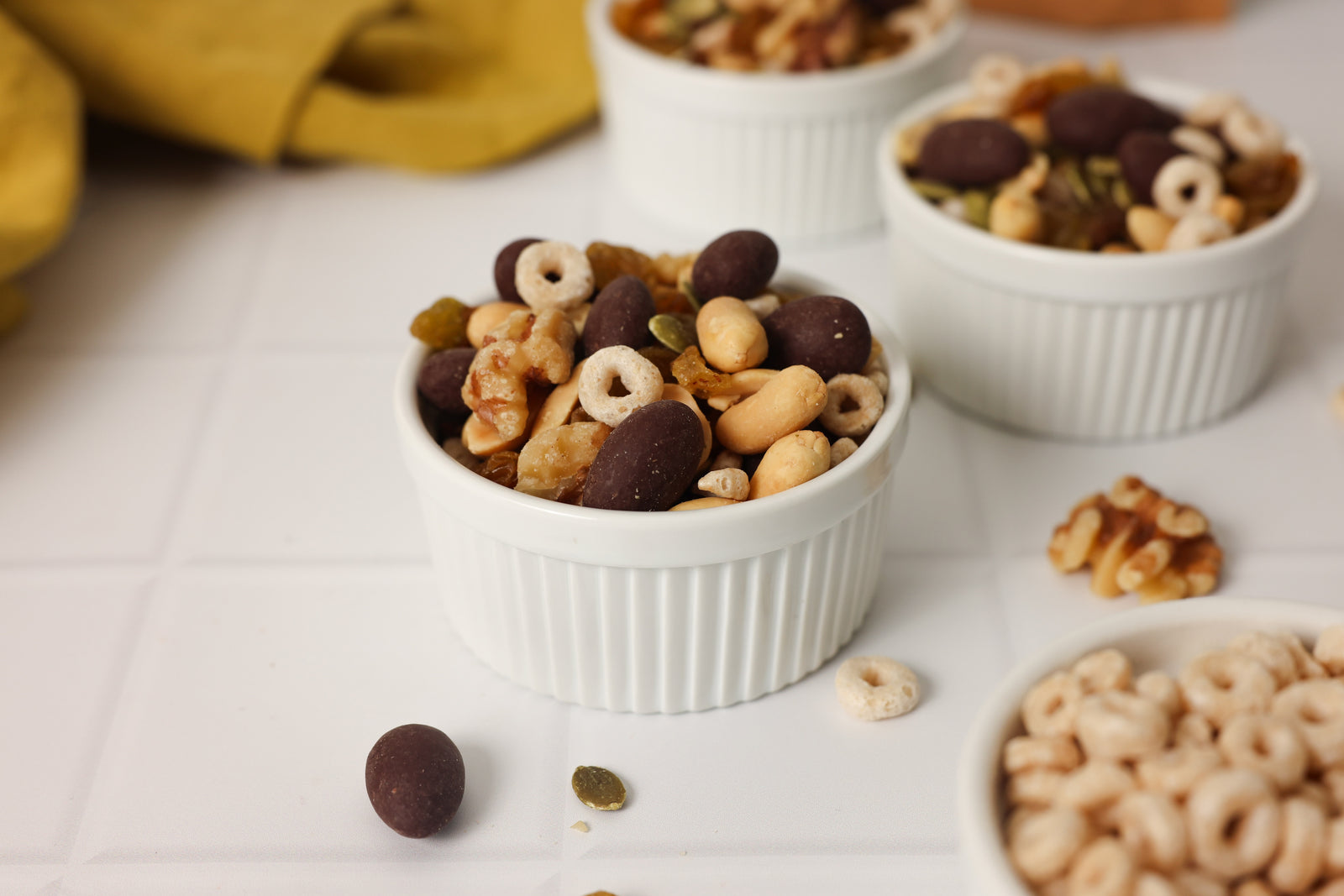white-ramekin-filled-with-chocolate-nuts-cereal-trail-mix